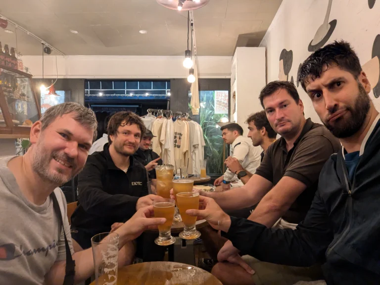 AFRC members sharing drinks together in Tokyo, celebrating the club’s community spirit.